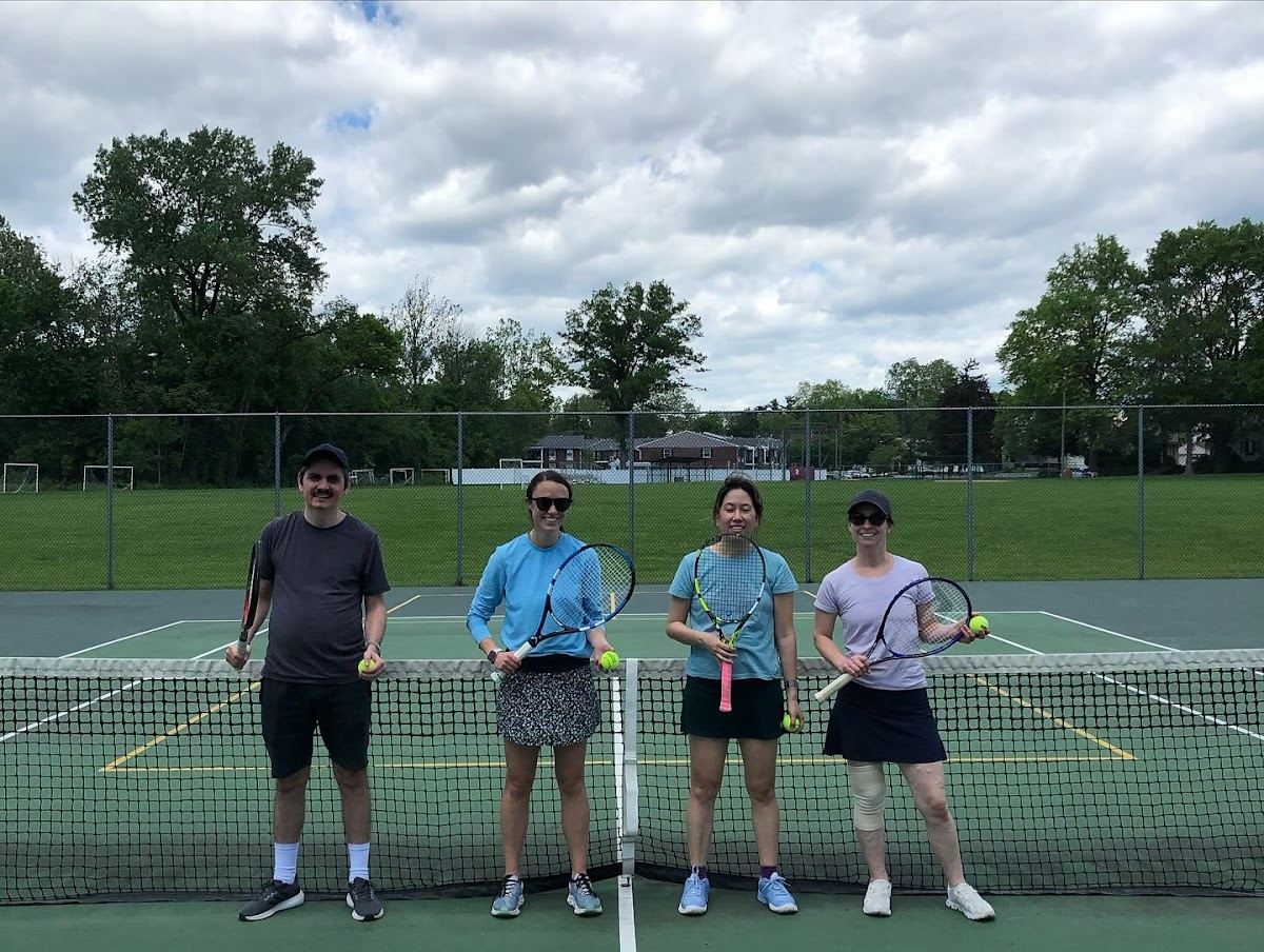 Adult tennis clinic session