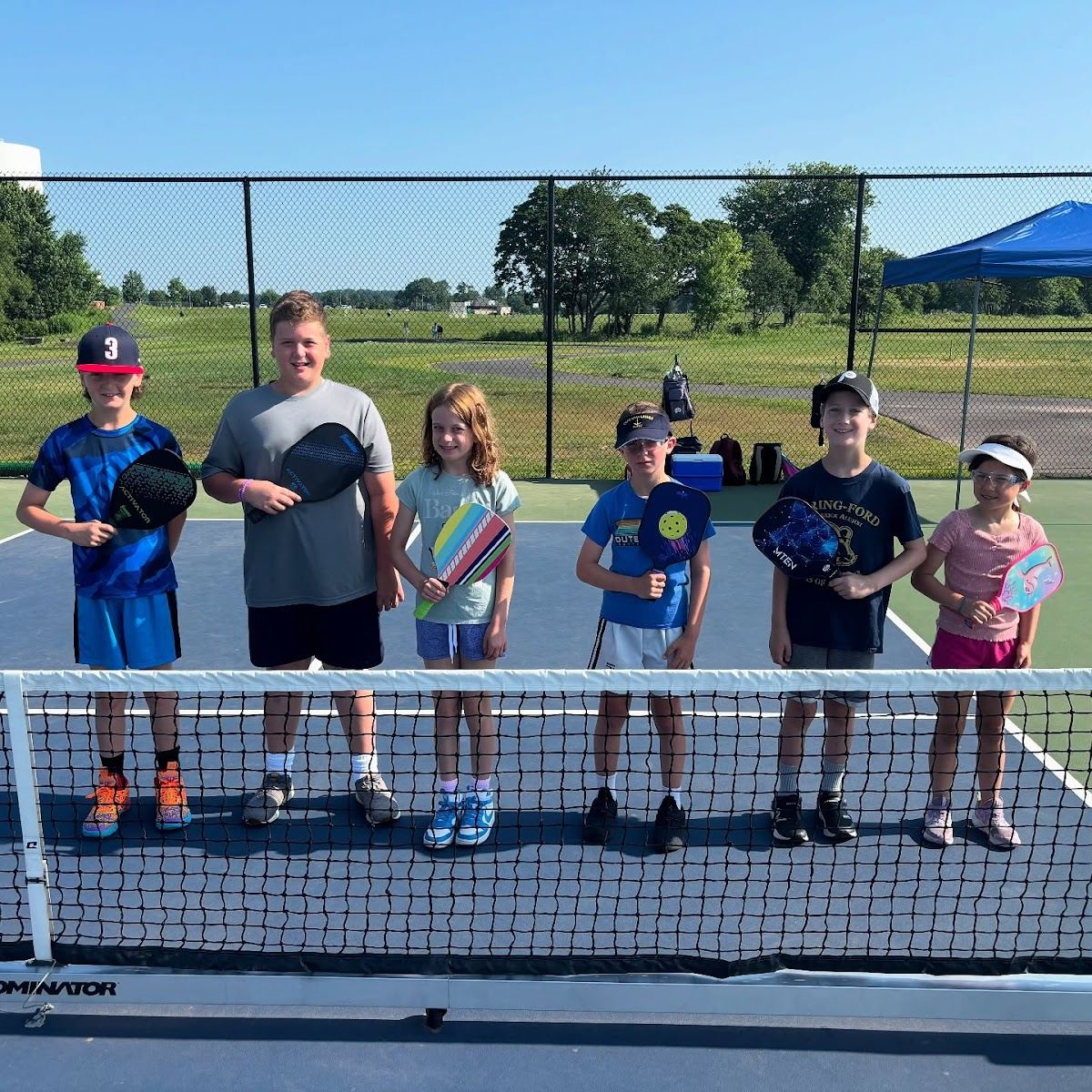Kids having fun at a Universal Rackets summer camp