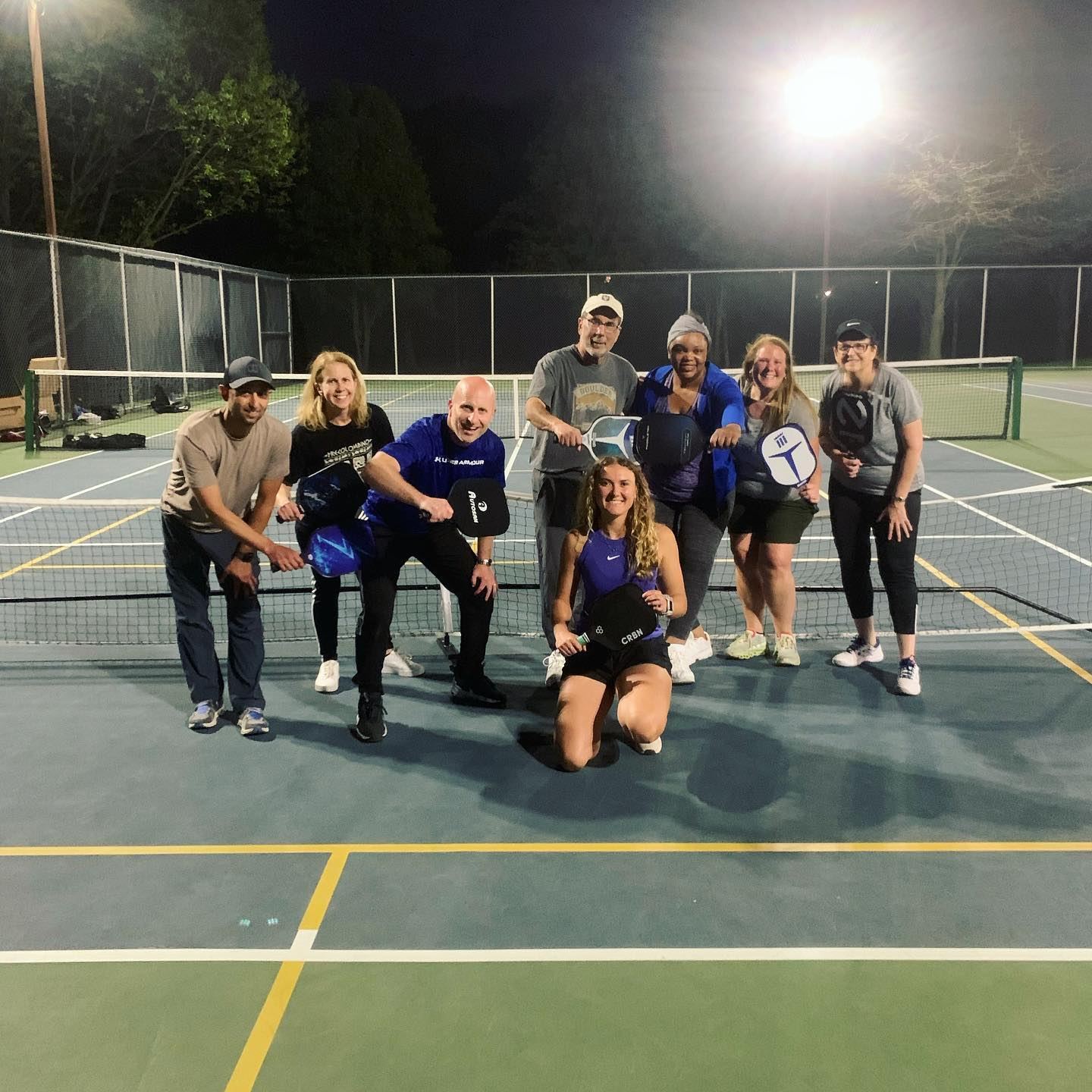 Universal Rackets coaches and players on court