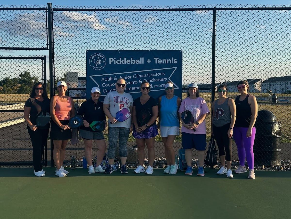 Adults drilling at a pickleball clinic